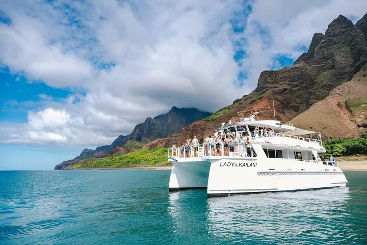 Large luxury catamaran with open decks on a Na Pali Coast boat tour from Port Allen, Kauai
