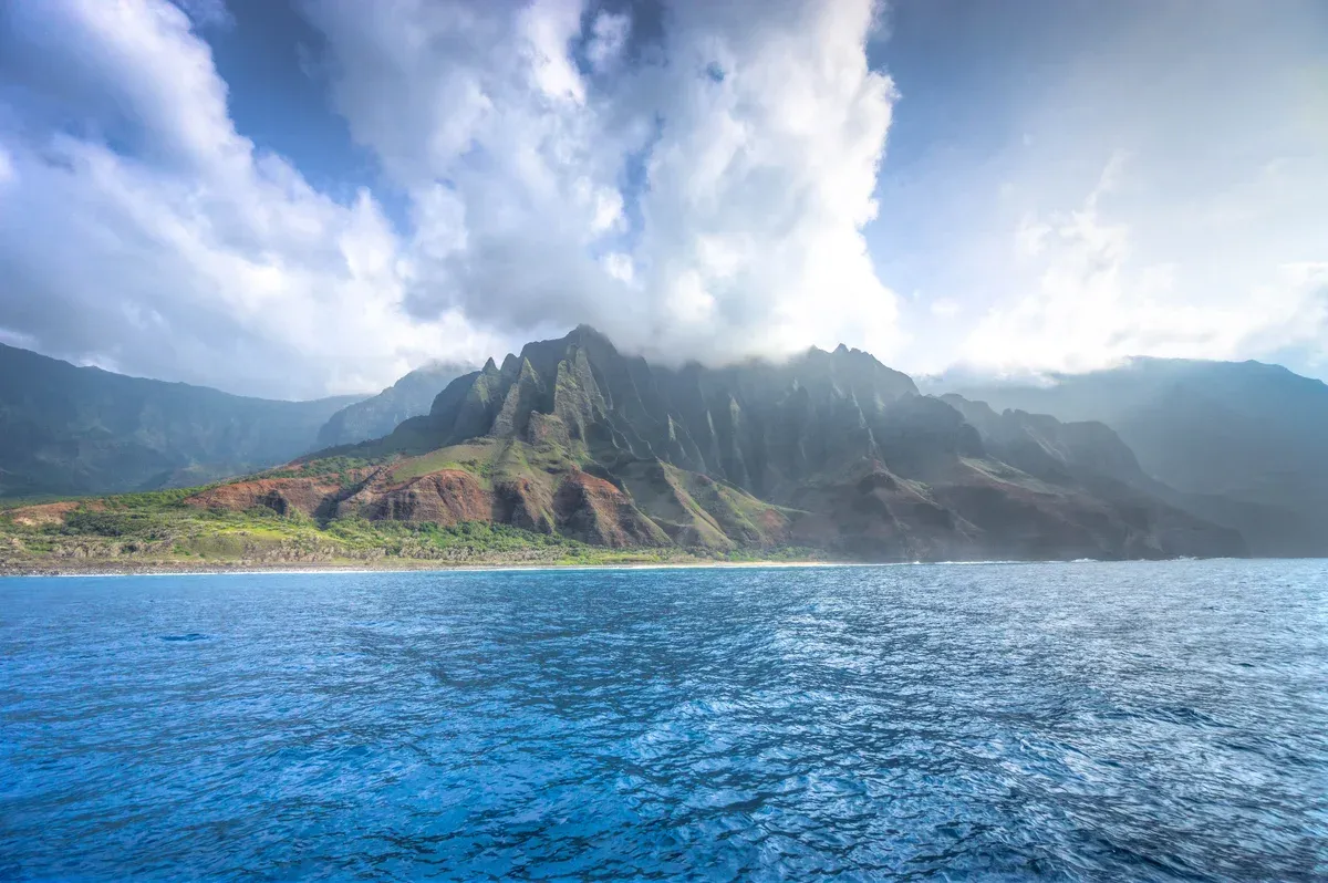 Afternoon light on the Na Pali Coast ridges photographed from a boat on a Kauai Napali Coast catamaran tour