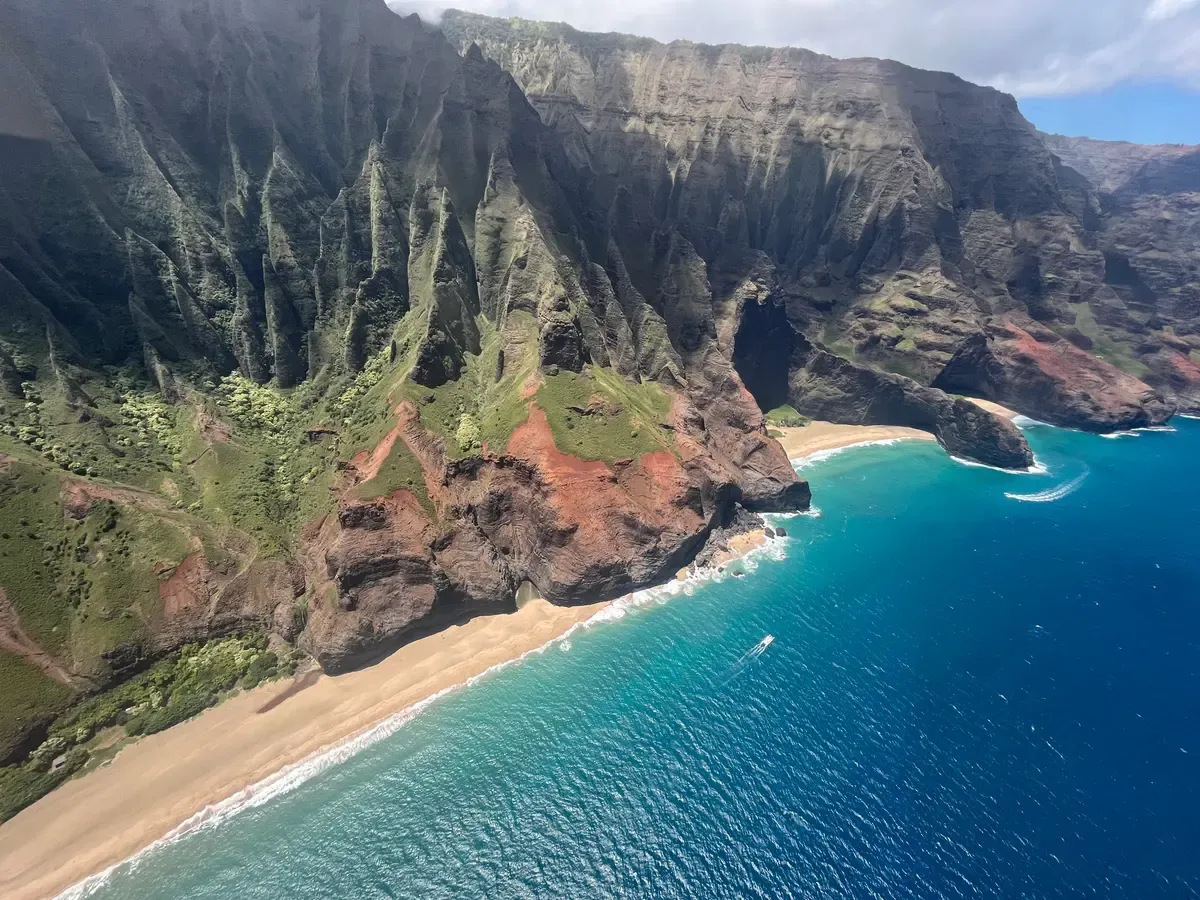 Na Pali Coast valley and beach from a helicopter over Kauai on a Napali Coast helicopter tour