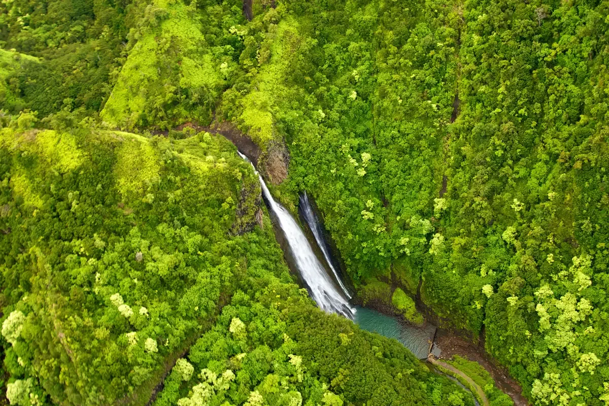 Manawaiopuna Falls from a Kauai helicopter, a stop on Napali Coast helicopter tours