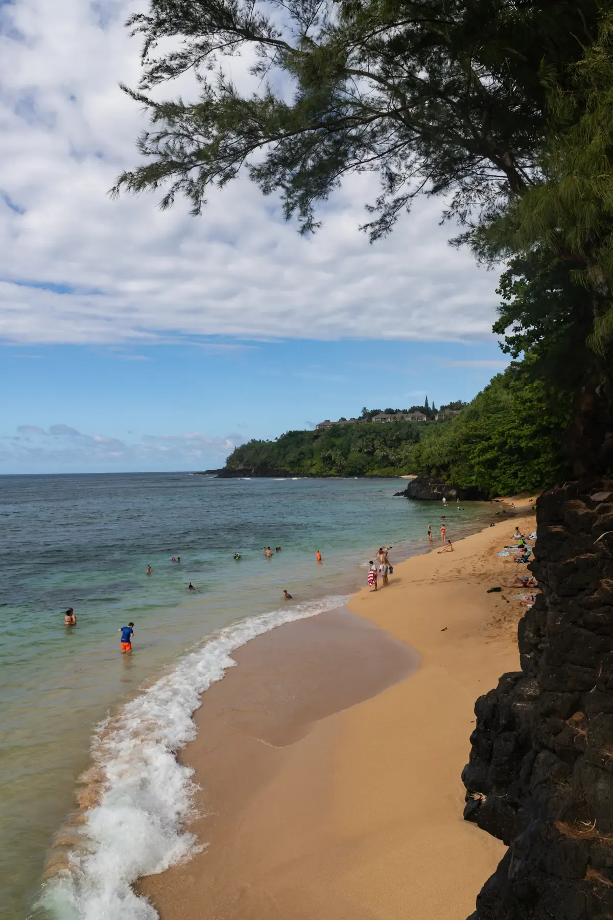 Snorkelers and swimmers at Hideaways Beach on Kauai's north shore near Napali Coast snorkel tours
